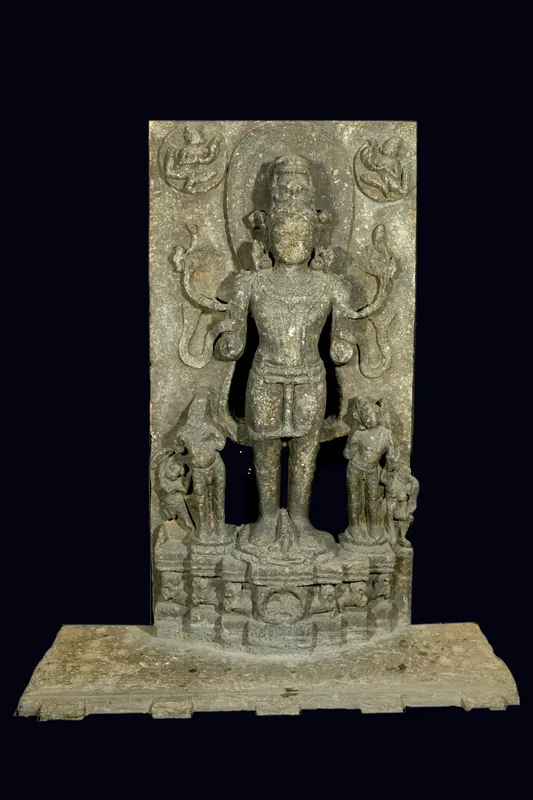 A temple site now represented only by a mound and a statue of Surja — photograph 2