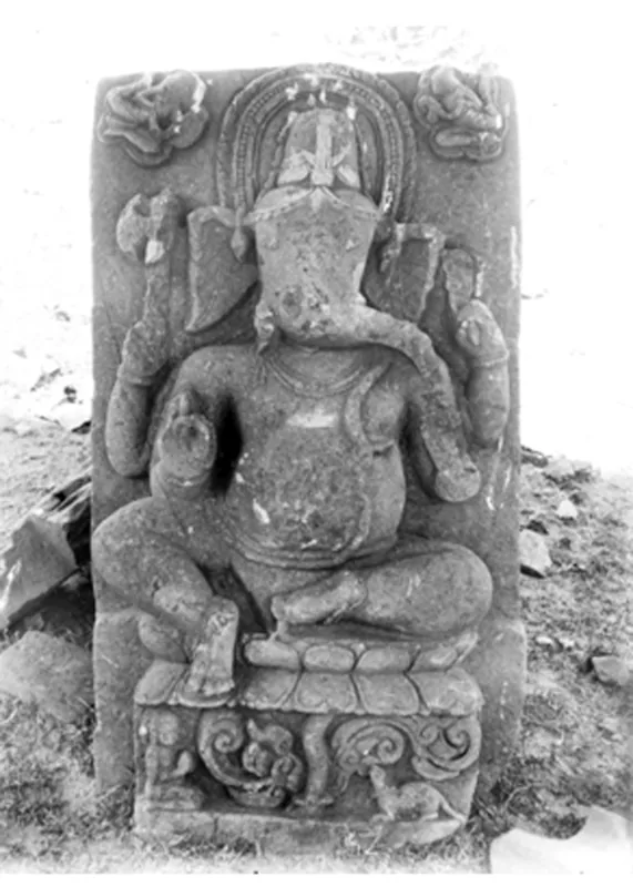 A temple site now represented only by a mound with statues of Ganesh and Nandi on it — photograph 1