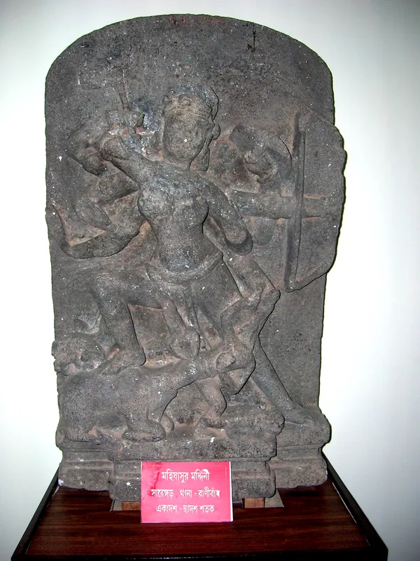 An image of Durga slaying Mohisasura under a tree — photograph 1